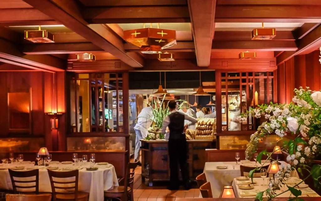 Discover 9 sustainable restaurants worldwide, leading in eco-friendly practices like local sourcing, zero-waste, and ethical dining. Dine green today! | Chez Panisse Interior