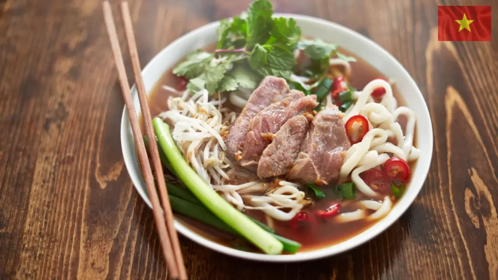 Vietnamese bowl of Pho (rice noodle soup with fragrant herbs and tender beef)